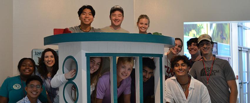 Southerners in front of a play ship at the Exploreum.